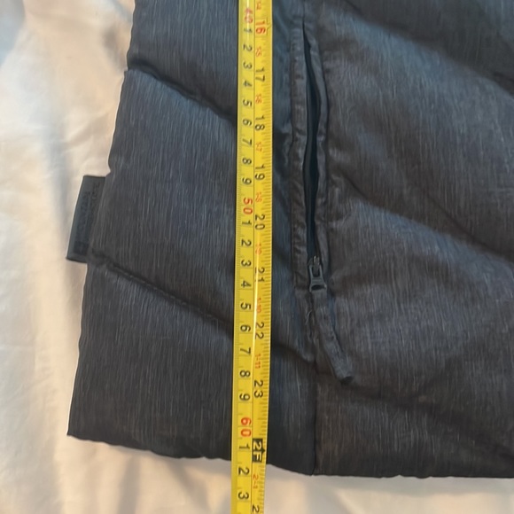 Gray puffy vest very warm. It was in the closet for a while. Never been used. - Picture 4 of 4